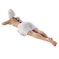 A Woman with Towel Wrapped Head Lying on Stomach During Relaxing Massage with Hot Stones
