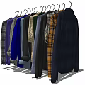 Stylish Hanging Clothes With Various Colors And Patterns On Wooden Hangers