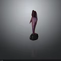 Vibrant Colored Dolphin Sculpture Standing In Upright Pose On Black Stone Base