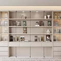 Modern Light Colored Bookcase With Open Shelves Drawers Decorative Items And Books