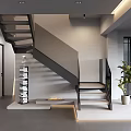 Modern Interior Gray Staircase with Black Railings Stacked Books Fireplace and Green Plant