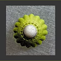 Yellow Badminton Shuttlecock Equipment With White Green Cork Top On Gray Base