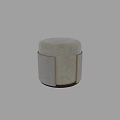 Light Gray Round Ottoman With Soft Fabric Upholstery And Gold Accents