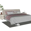 Cozy Kids Bed with Beige Headboard Pink Gray Bedding and Nightstand Potted Plant on Rug