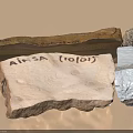 Various Natural Stone And Wood Pieces With Rough Textured Surfaces