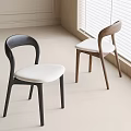 Modern Minimalist Dining Chairs With Black Brown Frames And White Cushions In Bright Room