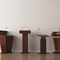 Four Wooden Podiums With Microphones Against White Wall And Wooden Floor