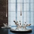 Silver Water Drop Sculptures with Dripping And Splashing Forms Against Grid Curtain And Dark Wall