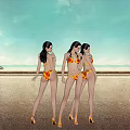 Three Women In Bikini Standing On Beach With Blue Sky White Clouds And High Heels