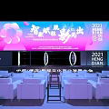 Modern Ballroom Event Space With Pink Blue Stage Backdrop And White Sofa Seats