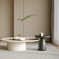 Modern Minimalist Light And Dark Circular Coffee Tables With Open Book Glass Vase Green Plant