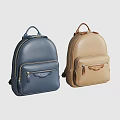 Two Blue and Beige Leather Backpacks With Zipper Pockets And Classic Design