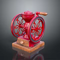 Red Vintage Kitchen Appliance With Wooden Base And Decorative Grinding Wheels