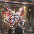 Gundam Model Display With Mechanical Wings Red White Blue Color And Exhibition Lighting
