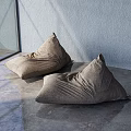 Brown Single Seater Bean Bag Chairs In Modern Room With Light Blue Wall And Gray Floor