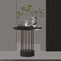 Side Table With Black Top Golden Metal Legs Green Plant White Vase And Glass Jar
