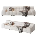 Modern Beige Velvet Sectional Sofa With Round Throw Pillows And Knitted Blanket