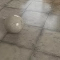 Neutral Beige Textured Floor Tiles With Decorative Sphere In Modern Interior