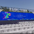 Marathon Event Venue With Blue Backdrop Stage And White Seats