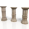 Three Classical Stone Columns With Ornate Carvings And Textured Bases