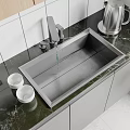 Stainless Steel Kitchen Sink With Faucet On Dark Marble Countertop And White Small Bowls