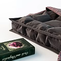 Everyday Living Items With Dark Cushion Woven Fabric And Green Cover Book