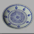 Plant Themed Decorative Pattern On Blue And White Ceramic Plate With Intricate Design