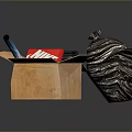 Open Cardboard Box with Nike Box Black Trash Bag on Cracked Mat