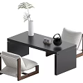 Black Tea Table and Chairs with Wood Frame Light Gray Cushions White Vase Green Plant Black Teapot