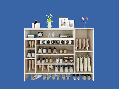 White Shoe Cabinet with Multiple Compartments for Various Shoes and Decorative Items on Top 3d model