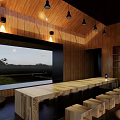 Modern Architectural Entrance With Wooden Roof Vertical Slats Black Columns Indoor Fireplace And Seats