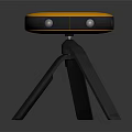 Sleek Orange And Gray Electronic Device With Circular Top And Tripod Stand Design