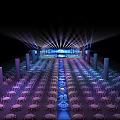 Modern Event Venue With Stage Lighting And Round Tables