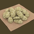 Natural Round Textured Stones Arranged in Pile on Brown Cloth Surface