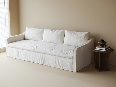 White Upholstered Sofa in Beige Room with Dark Wooden Side Table Books and Decorative Item 3d model