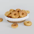 Fresh Golden Donuts in Wicker Basket with Some Scattered Around Them