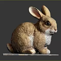 Brown Rabbit Sculpture Sitting On Gray Pad With Detailed Ears And Eyes