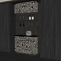 Elegant Wine Cabinet With Patterned Design And Brass Shelves Holding Wine Glasses