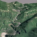 Aerial View Of Winding Mountain Roads In Lush Green Mountain Ranges