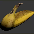Ripe Yellow Banana With Brown Spots On Dark Reflective Surface