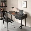 Modern Black Desk Setup With Table Lamp Camera Laptop Near Bookshelf And Wall Painting
