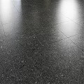 Black Marble Component with Sphere Base against Dark Columns and Circular Material Samples