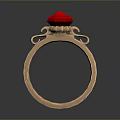 Elegant Gold Ring With Red Gemstone And Decorative Metal Details
