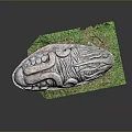 Ancient Mythical Creature Stone Carving With Intricate Patterns On Green Base