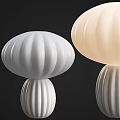 White and Beige Mushroom Shaped Table Lamps with Striped Design on Black Background