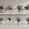 Various Beautiful Flowers in Glass Vases Arranged on White Shelves for Home Decor