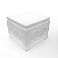 Dark Brown Wooden Box With Intricate Carved Patterns And White Bottle