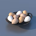 Pebble Shaped Food In Black Bowl With White And Light Brown Colors