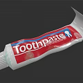 Daily Use Toothpaste in Red and White Tube with Blue Accent Design for Oral Care