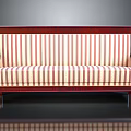 Vintage Sofa With Red And White Striped Upholstery And Wooden Frame